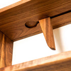 Close up detail shot of wall mounted walnut book stop - Biglow Woodcraft - Walnut Book Shelf