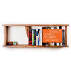 Book Stop assembled and mounted on wall holding a row of books - Biglow Woodcraft - Walnut