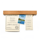 Gravity Bar wall mounted paper holder with award displayed and post card displayed - Biglow Woodcraft - Cherry